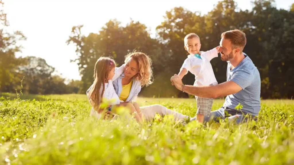 A family playing together on the grass